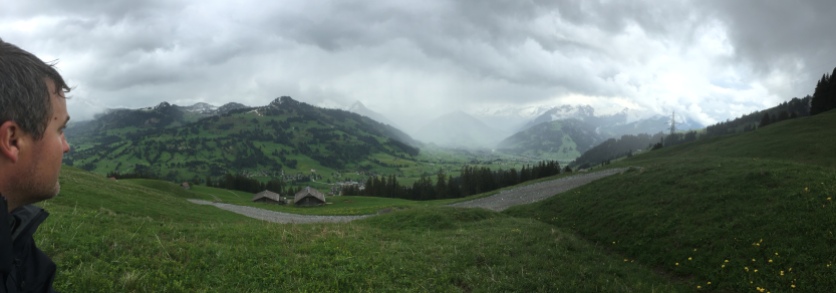 Mountains in Switzerland. Luke's head is wet from rain.